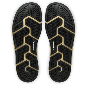 Sula av Joe Nimble Addict barfotasko i färgen brun/beige, visad underifrån. Yttersulan är svart med beige detaljer och har ett tekniskt mönster från Michelin® för ökat grepp, flexibilitet och hållbarhet vid naturlig fotrörelse.